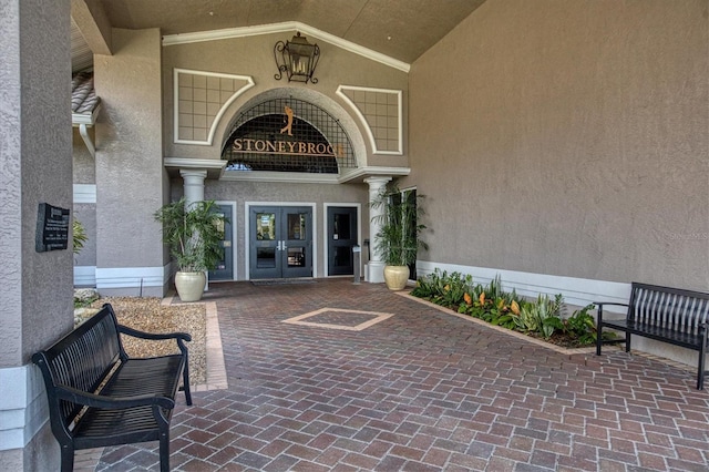 view of exterior entry featuring french doors