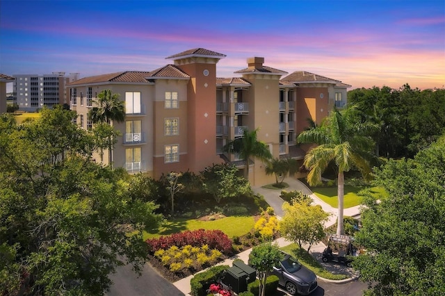 view of outdoor building at dusk