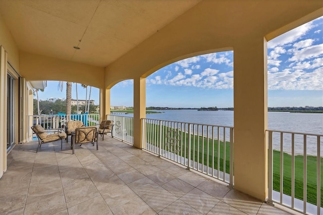 balcony featuring a water view