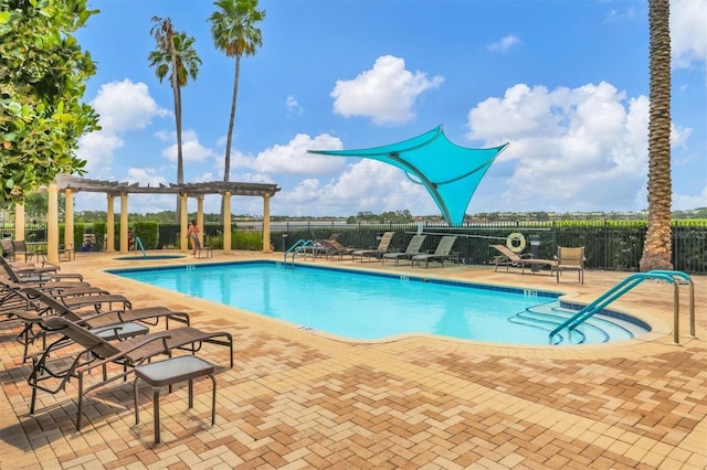 community pool with fence, a pergola, and a patio area