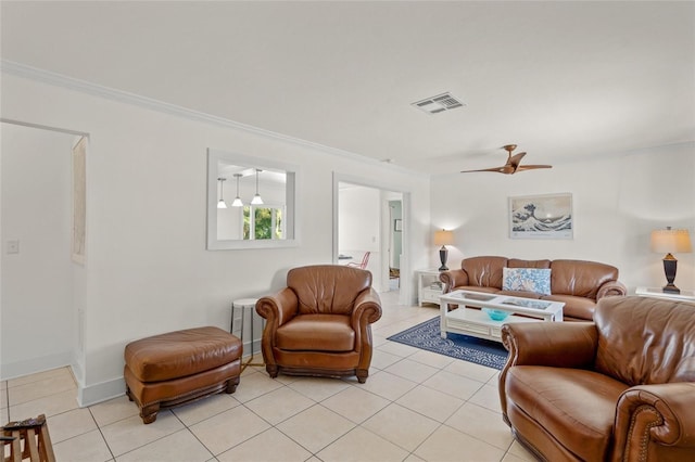 tiled living room featuring ceiling fan and crown molding