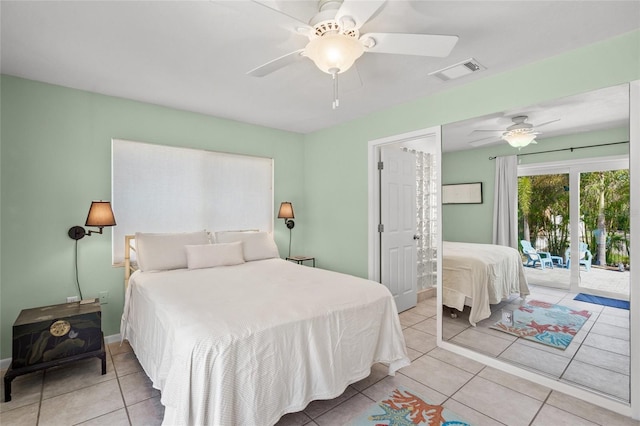 tiled bedroom with access to outside and ceiling fan