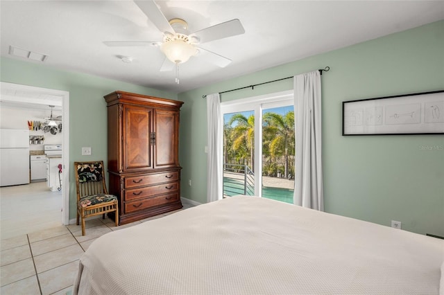 bedroom with access to exterior, ceiling fan, white fridge, and light tile patterned floors