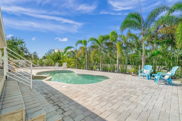 view of swimming pool featuring a patio area