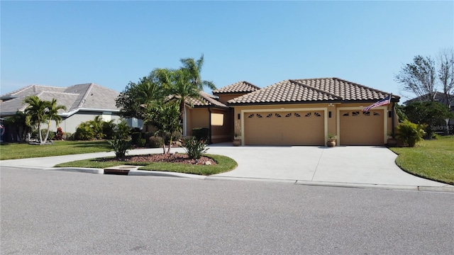 view of front facade featuring a front yard and a garage