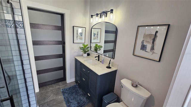 bathroom with tile patterned floors, toilet, and vanity