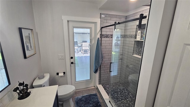 full bath with a stall shower, tile patterned flooring, vanity, and toilet