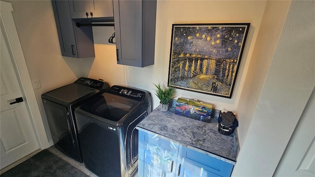 laundry room with cabinets and independent washer and dryer