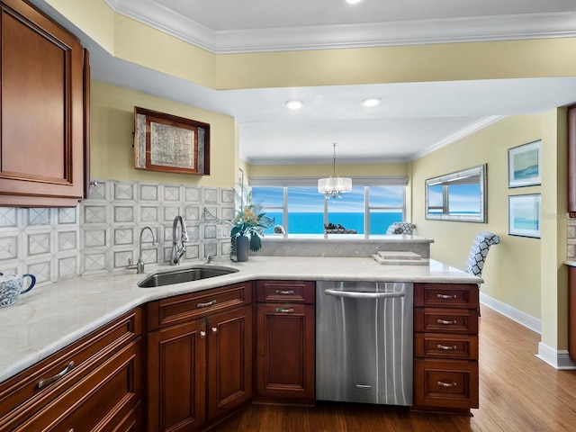 kitchen featuring sink, tasteful backsplash, stainless steel dishwasher, pendant lighting, and ornamental molding