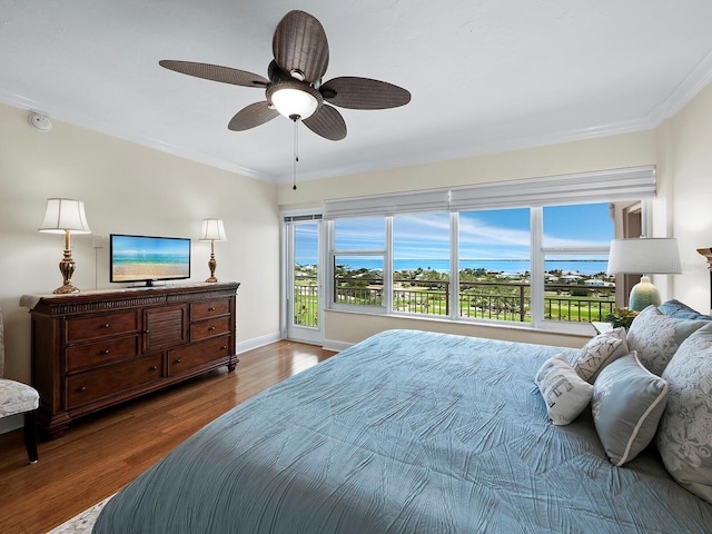 bedroom with hardwood / wood-style floors, ceiling fan, access to exterior, and crown molding