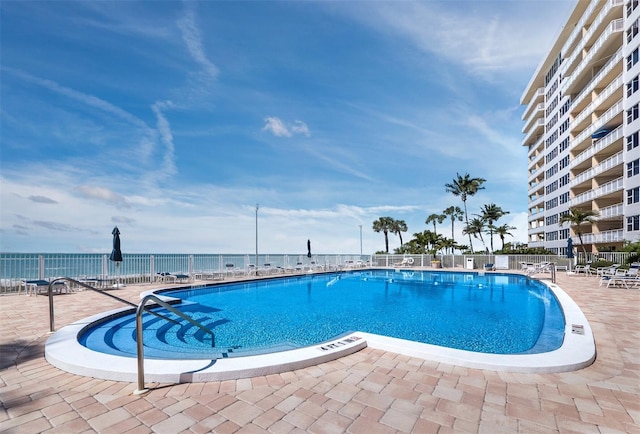 view of swimming pool with a patio area