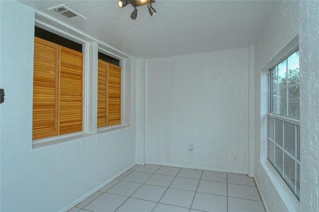 view of tiled spare room