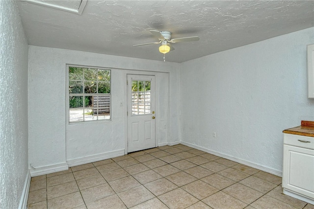 unfurnished room featuring ceiling fan