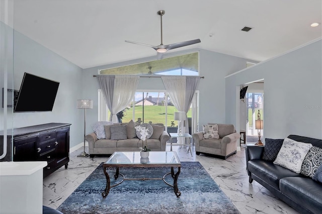 living room featuring ceiling fan and lofted ceiling