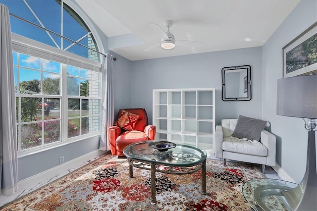 living area with ceiling fan