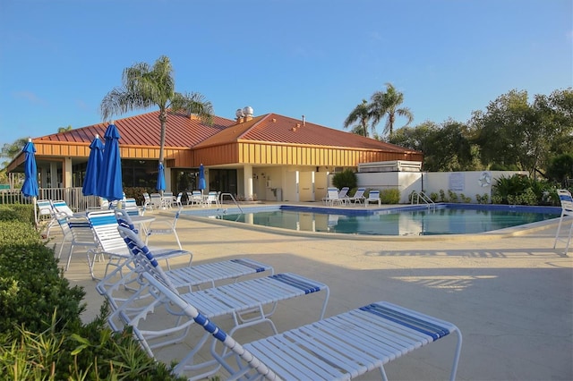 view of swimming pool with a patio