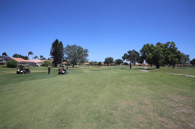 view of property's community featuring a lawn