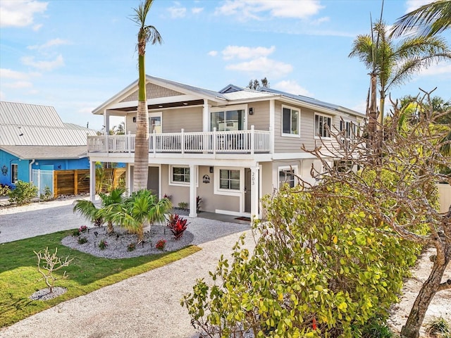 back of property with a balcony