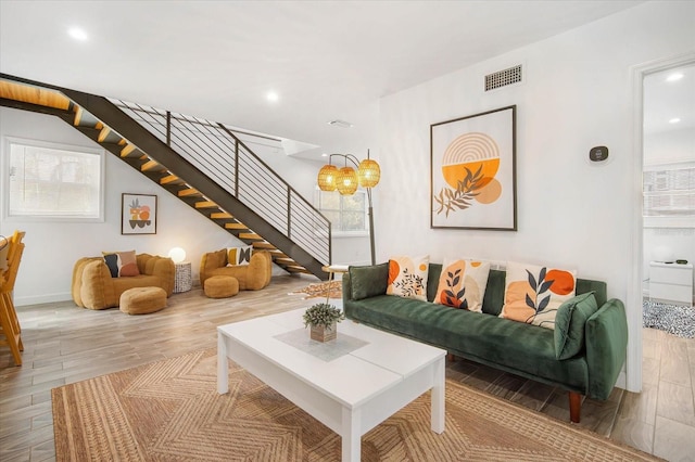 living room featuring hardwood / wood-style floors and plenty of natural light