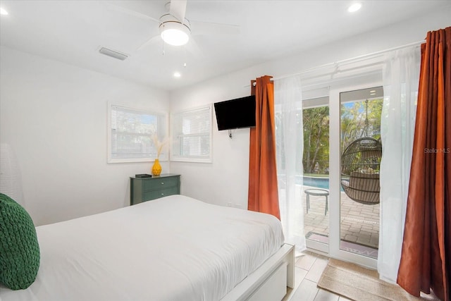 tiled bedroom with ceiling fan and access to exterior