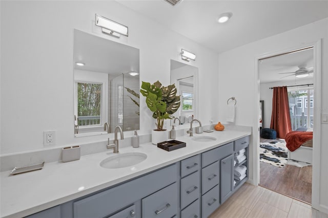 bathroom featuring ceiling fan, tile patterned floors, and vanity