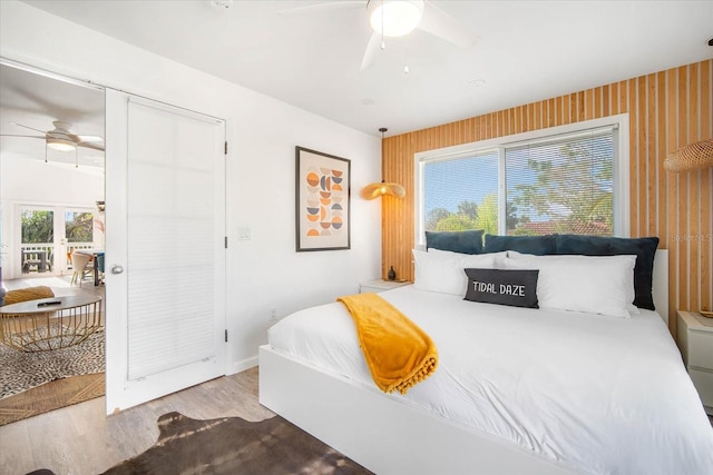 203 72nd St, Holmes Beach, FL 34217 - bedroom featuring baseboards, a ceiling fan, and wood finished floors