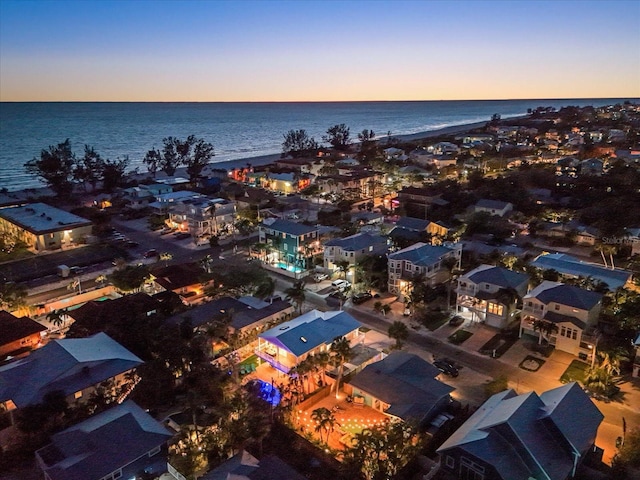 203 72nd St, Holmes Beach, FL 34217 - aerial view at dusk featuring a water view
