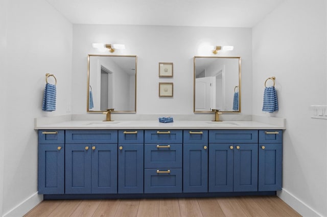 bathroom featuring hardwood / wood-style floors and vanity