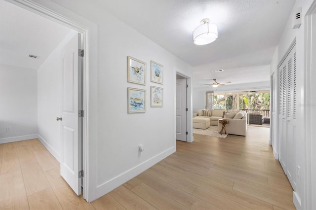 hall featuring light hardwood / wood-style floors