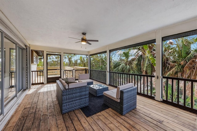 sunroom / solarium with ceiling fan