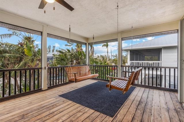 sunroom with ceiling fan