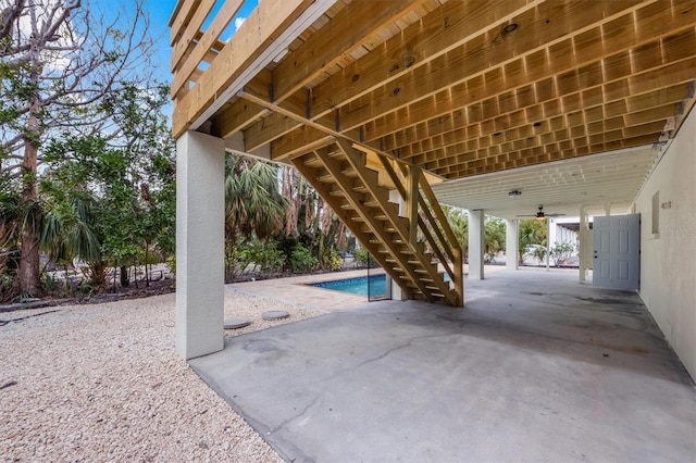 view of patio featuring ceiling fan