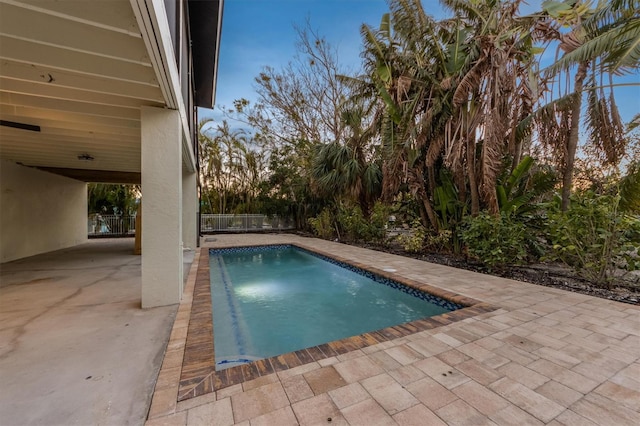 view of swimming pool featuring a patio area