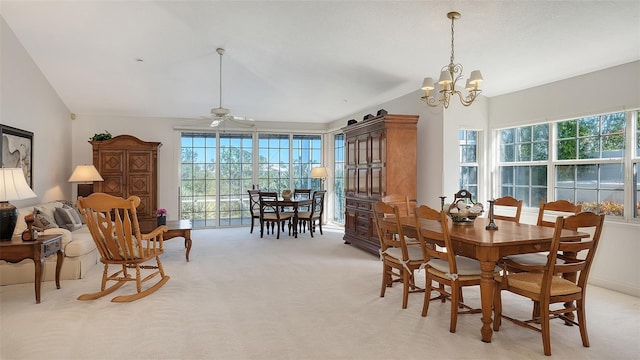 dining room with light carpet and ceiling fan with notable chandelier