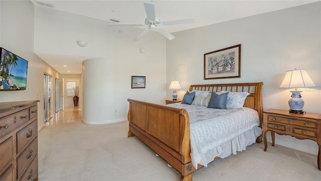 bedroom featuring light carpet and ceiling fan