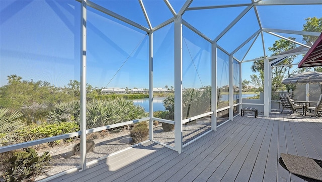 deck featuring a water view and a lanai