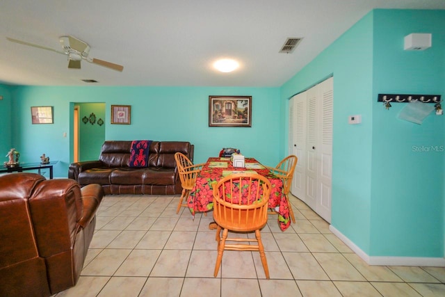 dining area featuring ceiling fan and light tile patterned floors