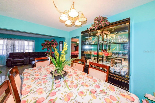 dining room featuring a notable chandelier