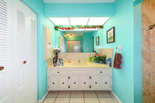 bathroom with tile patterned floors and vanity