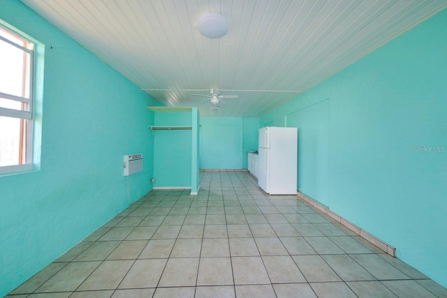 spare room featuring ceiling fan and plenty of natural light