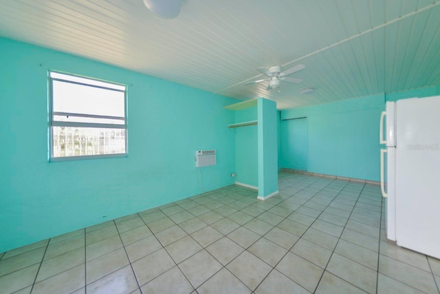 tiled empty room with ceiling fan