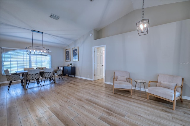 interior space featuring vaulted ceiling and light hardwood / wood-style flooring