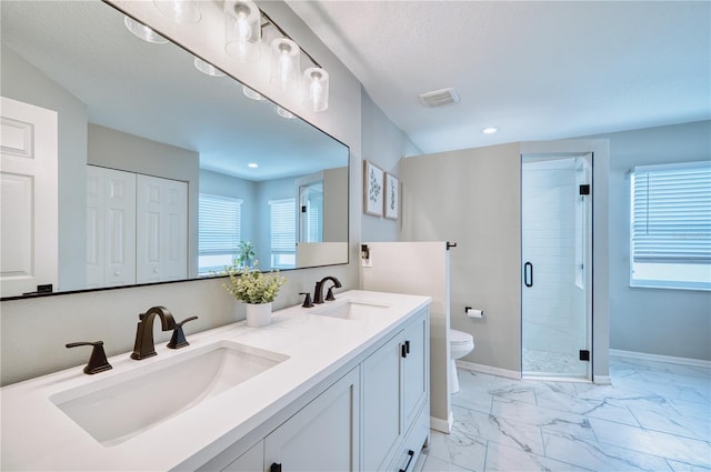 bathroom with a shower with shower door, a textured ceiling, toilet, and vanity