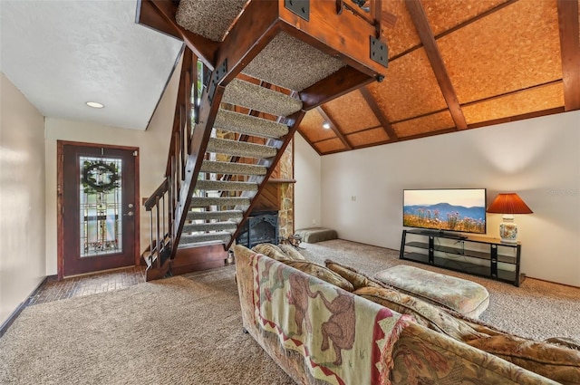 carpeted living room featuring lofted ceiling