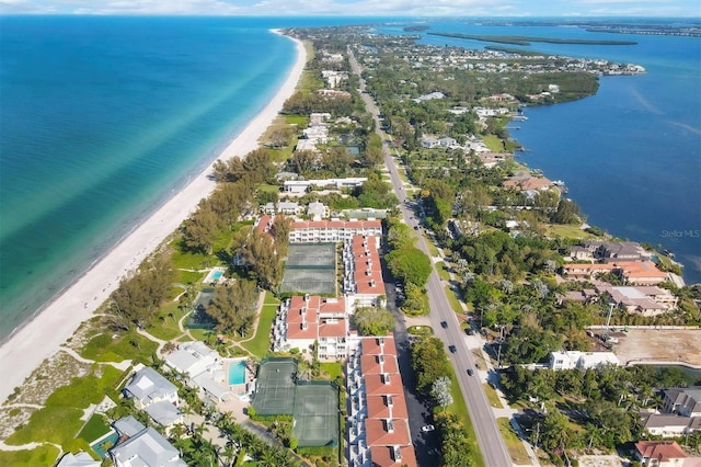 birds eye view of property featuring a view of the beach and a water view