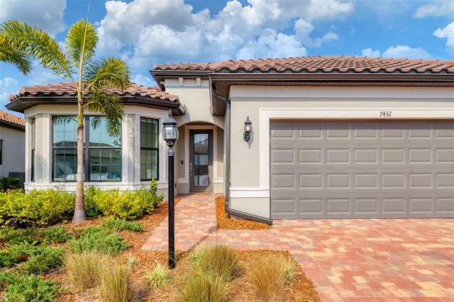 mediterranean / spanish-style house featuring a garage