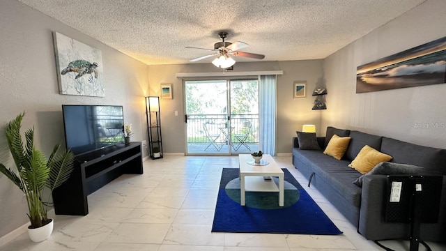 living room featuring ceiling fan and a textured ceiling