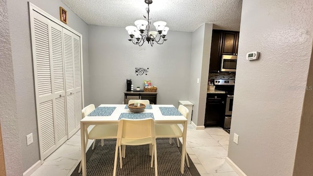 dining space with a textured ceiling and a chandelier