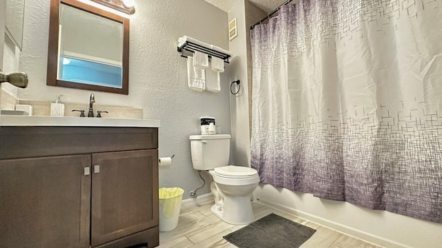 full bathroom with vanity, toilet, shower / bathtub combination with curtain, and a textured ceiling