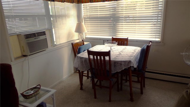 carpeted dining space with cooling unit and baseboard heating